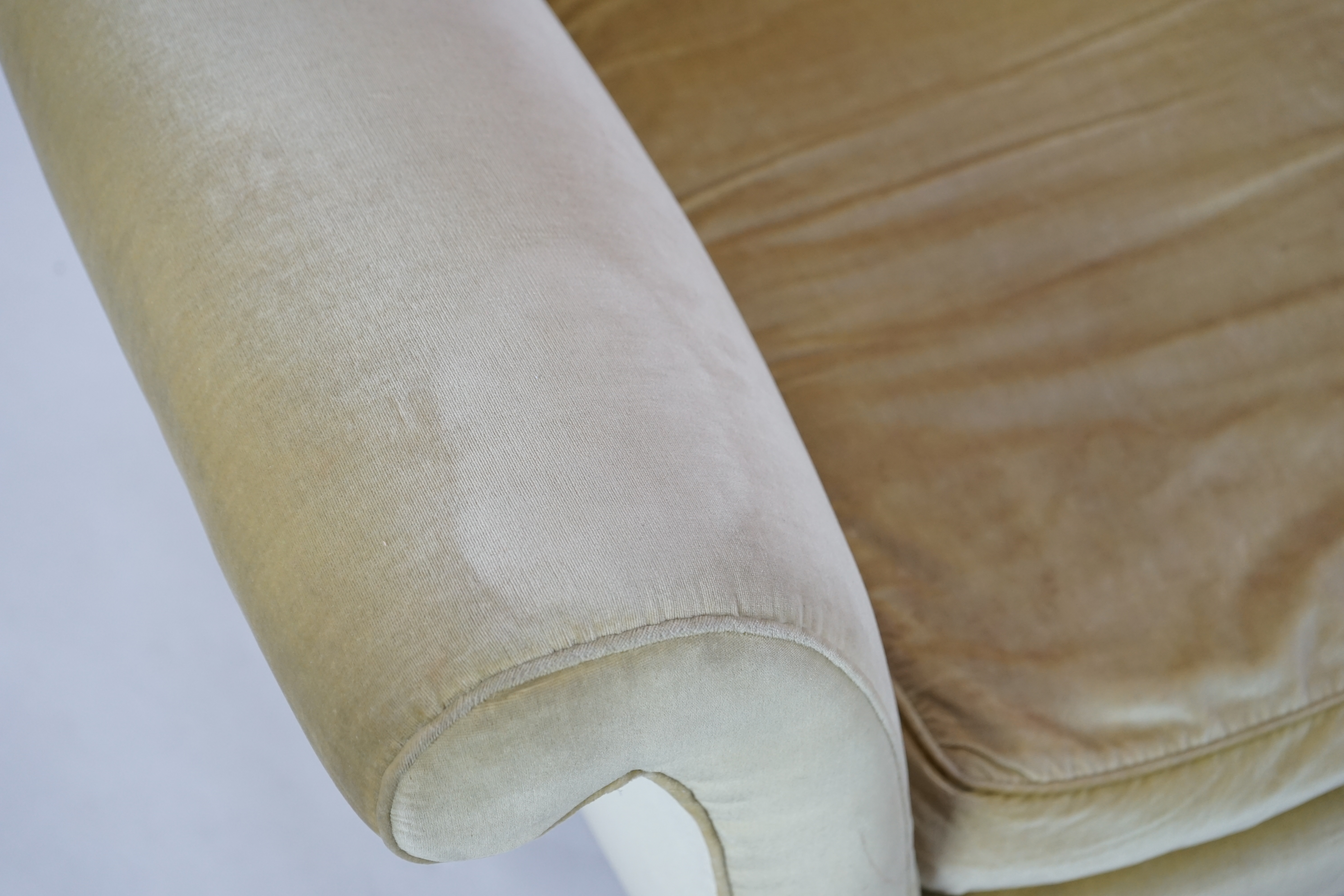 A large Victorian sofa, in the manner of Howard & Sons, probably Swietenia mahagoni with a Fagus sylvatica frame